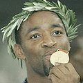 Darren Campbell celebrates winning gold at the 2004 Olympics