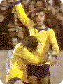 George Best clebrates coring whilst wearing the 1970's Manchester United yellow third kit