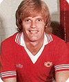 Gordon McQueen wears one of the many kits worn by Manchester United during the 1979-80 season