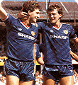 Norman Whiteside celebrates with Bryan Robson after scoring at Southampton in the 1987 season's third choice kit