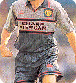 The ill-fated 1995 Manchester United grey away strip fades into the background
