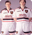 Ole Gunnar Solskjaer and David Beckham model the 1997 Manchester United away kit